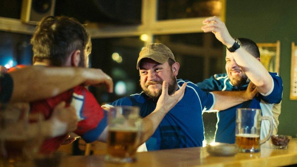 A pub fight, posed by models