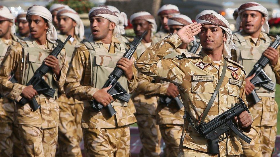 Qatari army forces take part in a military parade during the Gulf emirate's National Day celebrations in Doha 18 December 2013