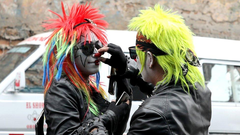 Clowns prepare themselves to take part in a parade during Peru's Clown Day celebrations in Lima, Peru May 25, 2018