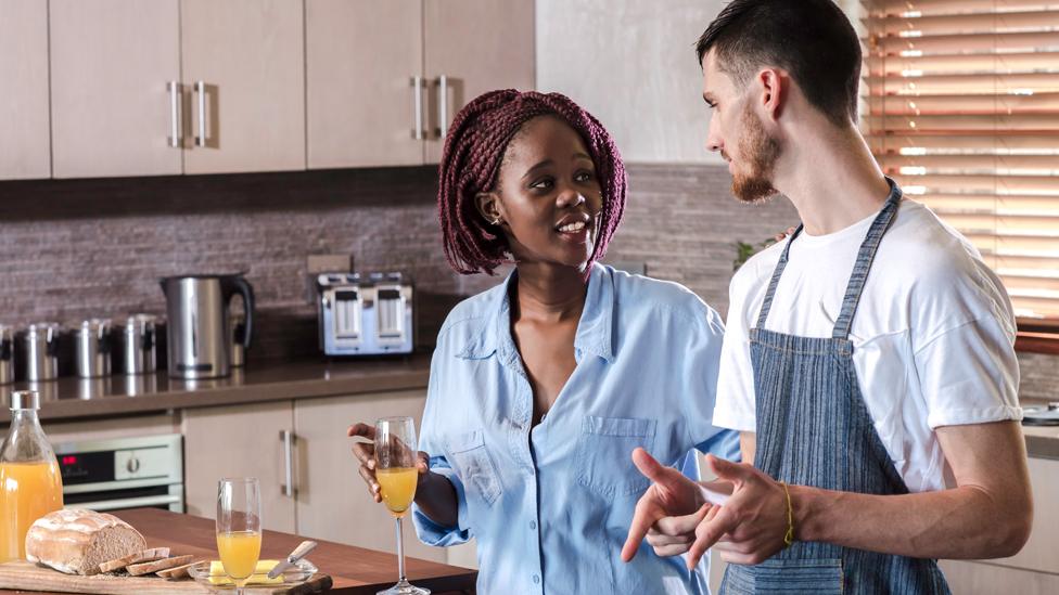 Couple cooking in kitchen