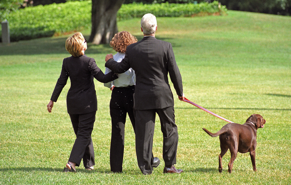 The Clintons, with daughter Chelsea, take a walk in the White House grounds in 1999