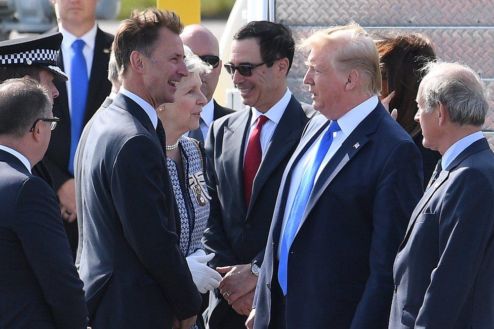 Foreign Secretary Jeremy Hunt greets President Trump on the tarmac at Stansted airport