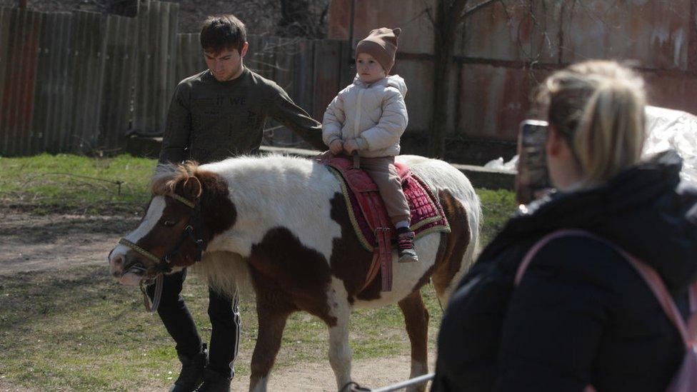 girl-riding-animal.