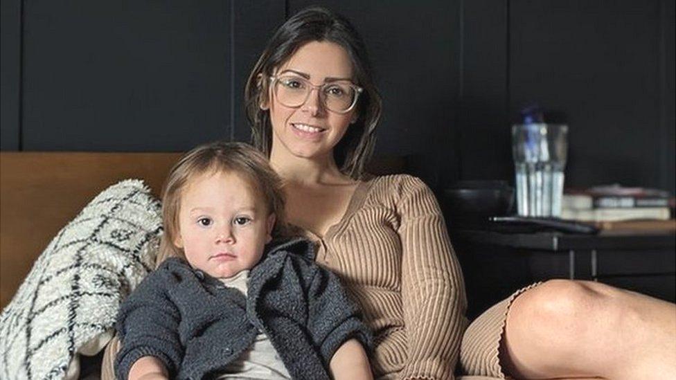 mum with toddler, sitting together on bed