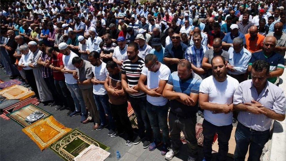 Worshippers pray outside Lions' Gate (14/07/17)