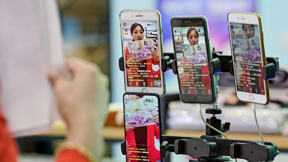 A presenter promotes bed linings through a live streaming show in Zhejiang province ahead of Singles' Day on November 10, 2019.