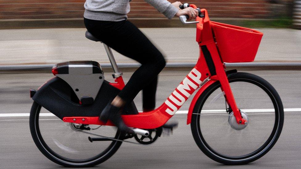 Woman riding a Jump Bike