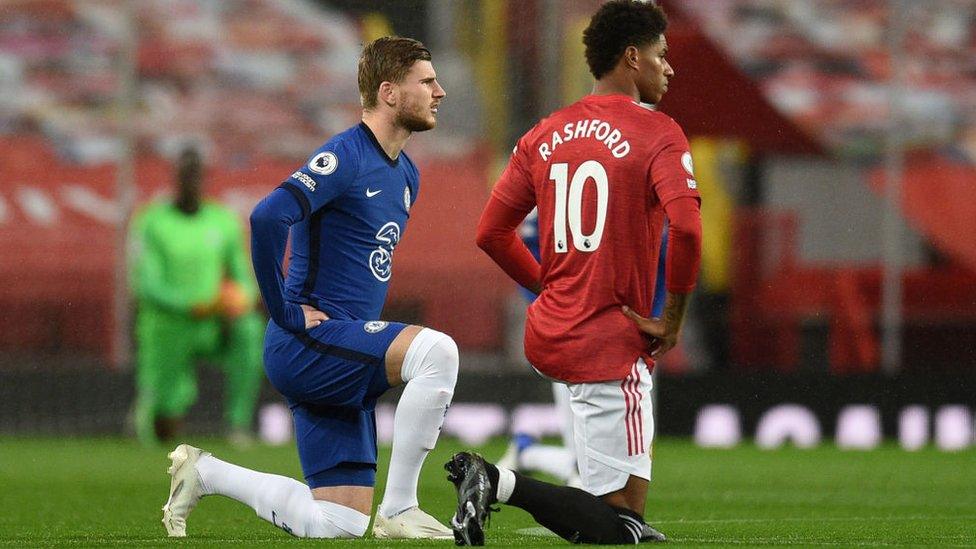 Werner and Rashford kneeling.