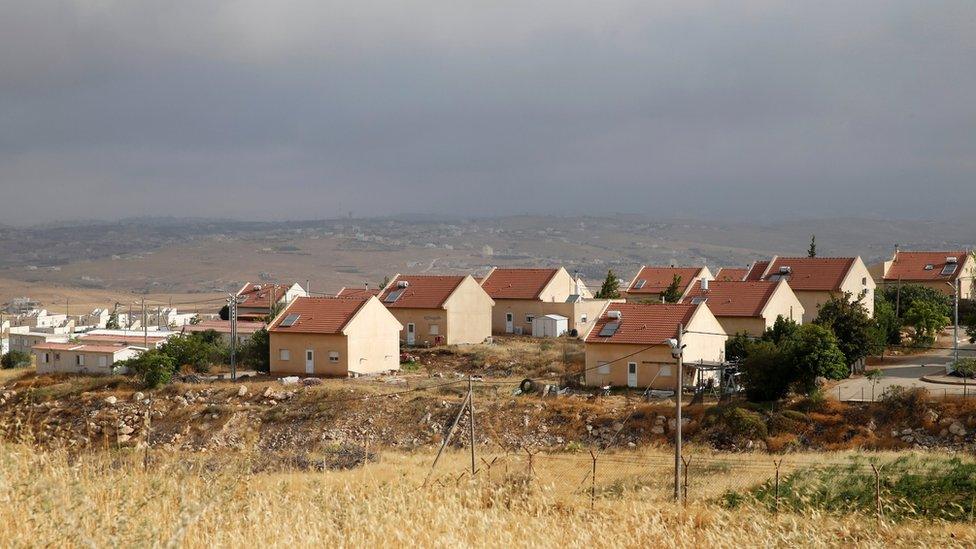 Houses are seen in the West Bank Jewish settlement of Karmel, near Hebron on 24 May