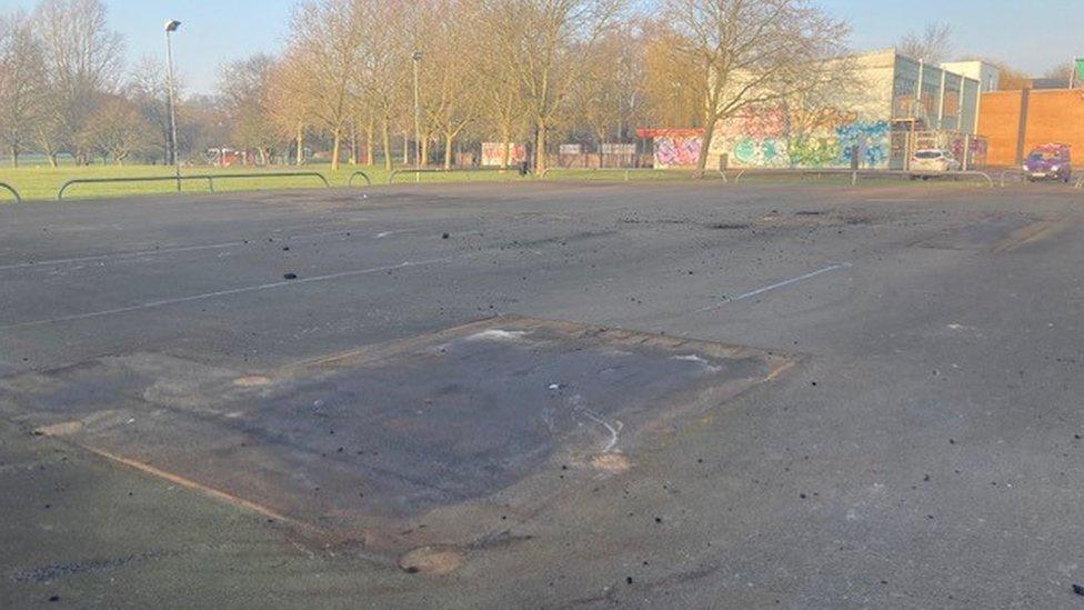 An empty skate park with ramps removed