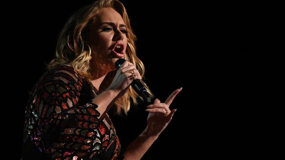 Adele performs onstage during the 59th Annual Grammy music Awards