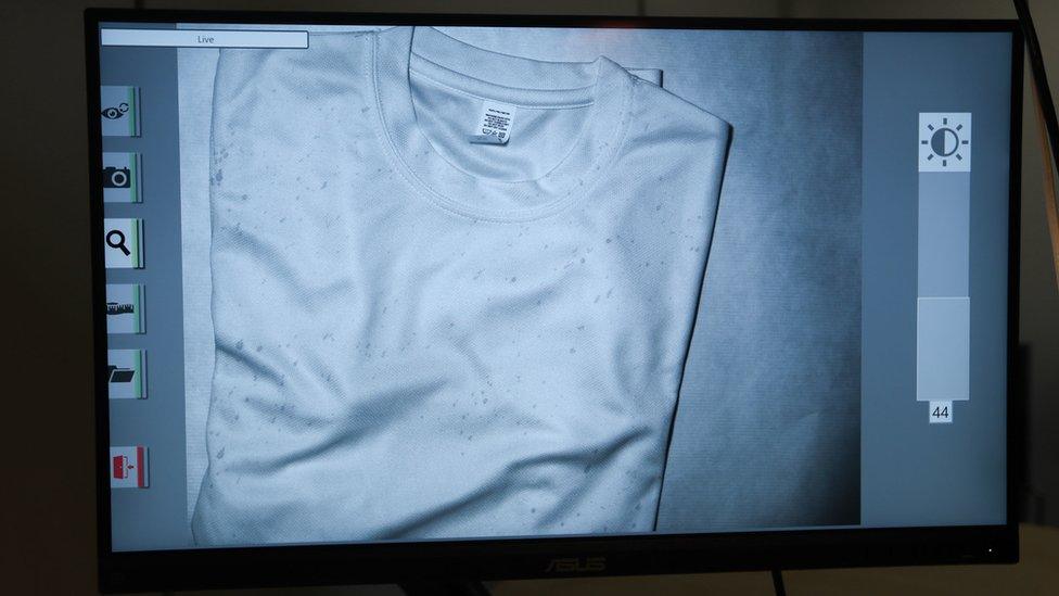 Blood specks seen on a black shirt during a demonstration by the Metropolitan Police forensic operations