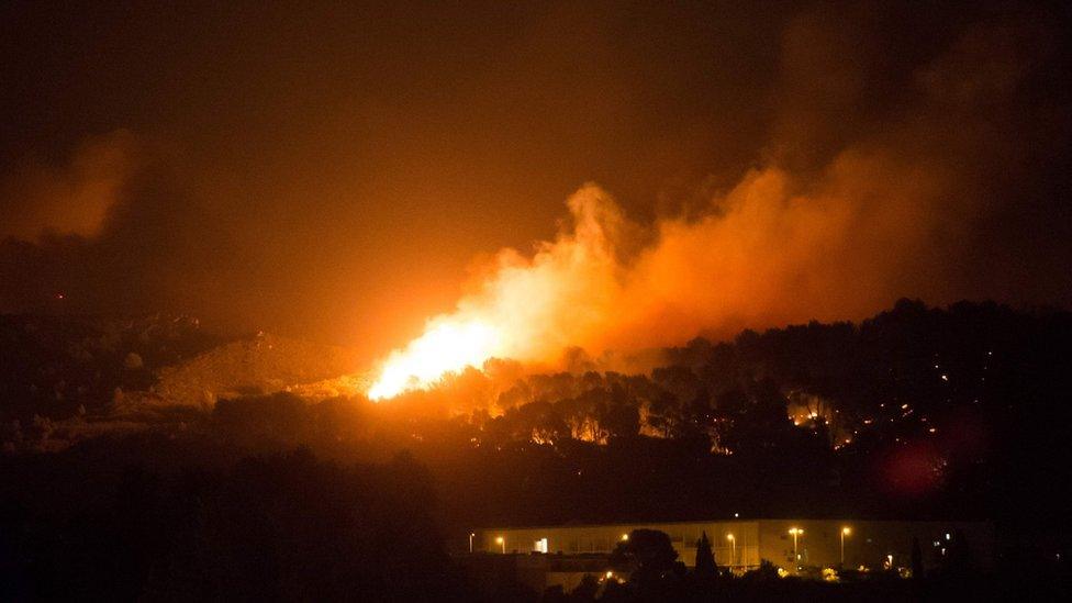 Fire spreads above the main road near Vitrolles, southern France, on August 10, 2016