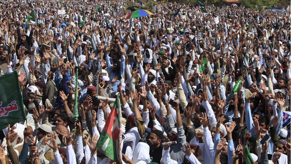 Islamist activists chant slogans over the execution of Mumtaz Qadri, as they gather at Rawalpindi's Liaqat Bagh before marching towards Islamabad.