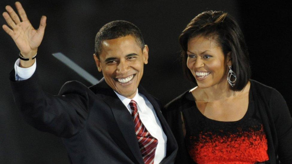 Barack Obama and his wife Michelle stand on stage during their election night victory rally at Grant Park on November 4, 2008 in Chicago, Illinois