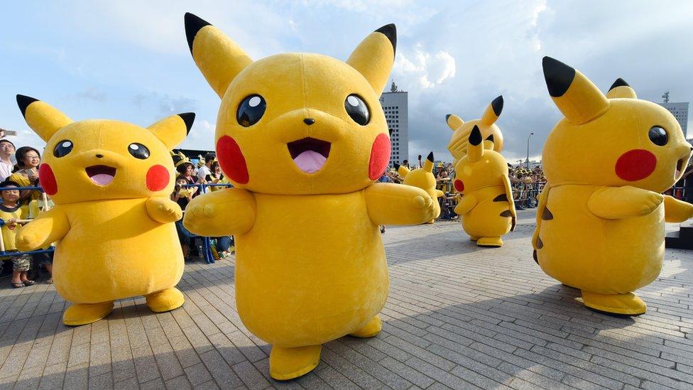 Dozens of people dressed up as Pikachu, the famous character of Nintendo's videogame software Pokemon