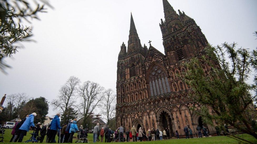 Members of the public queue outside Lichfield Cathedral