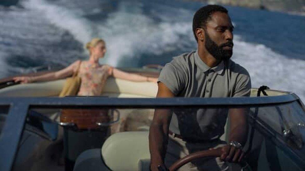 John David Washington with Elizabeth Debicki in Tenet