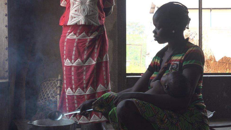 A mother feeds her child in Bambari, Central African Republic