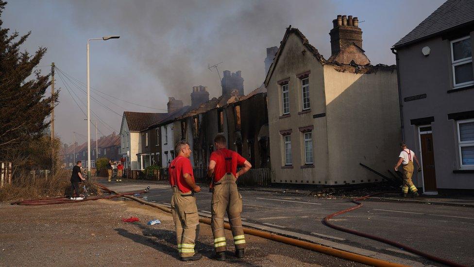 Firefighters at the scene of a blaze that destroyed a number of homes in Wennington, Essex