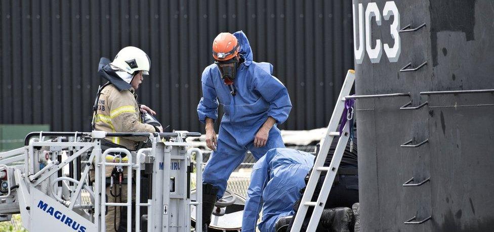 Danish police technicians investigating the recovered privately owned submarine Nautilus UC3 in Copenhagen Harbour