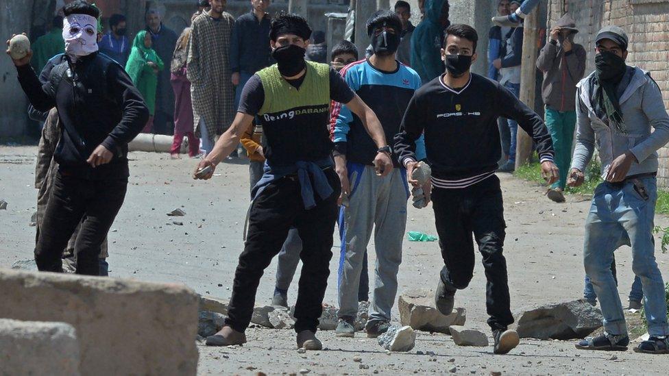 Kashmiri protestors clash with Indian security forces near a polling station in Srinagar on April 9, 2017.