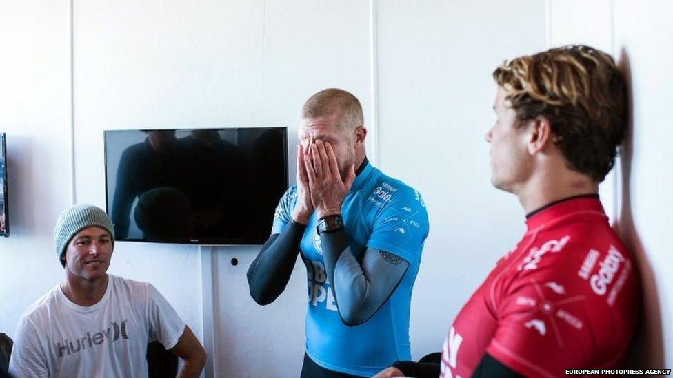 A handout picture made available by the World Surf League of Australia's Mick Fanning (C) reacting after being attacked by a shark in the final round of the JBay Open surfing event as part of the World Surf League in Jeffreys Bay, South Africa, 19 July 2015.