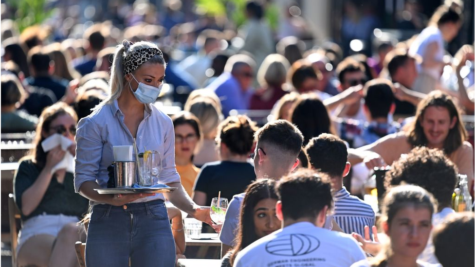 Waitress serving drinks