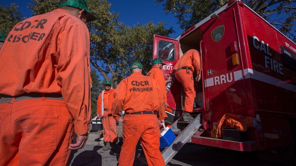 Prisoners at Oak Glen Conservation Camp leave for work deployment under the authority of Cal Fire on September 28, 2017