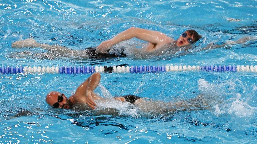 Two men in a swimming pool