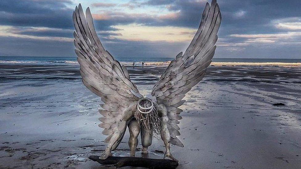 Angel statue on beach