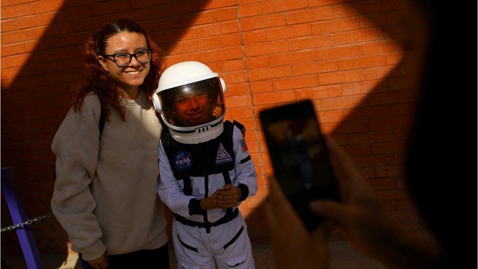 Boy dressed as astronaut.