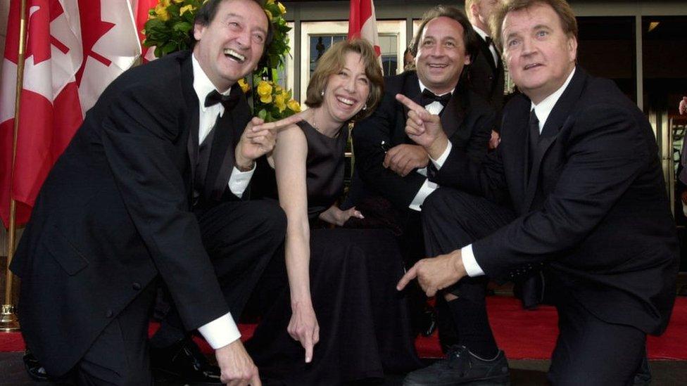 Cast members from SCTV, including Joe Flaherty (far left) around their star on the Walk of Fame in Toronto, Canada