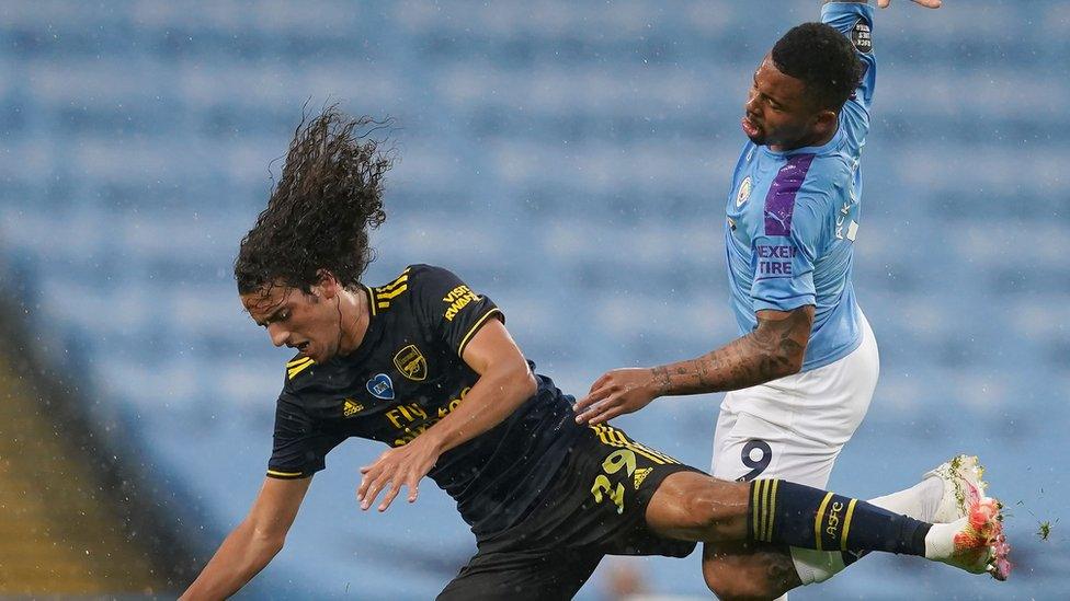 Gabriel Jesus tackles a player