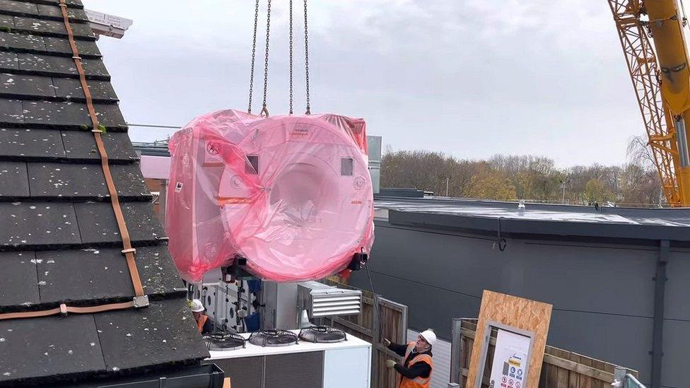 MRI being lowered