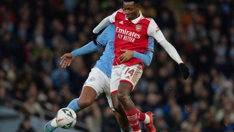 Eddie Nketiah of Arsenal and Manuel Akanji of Manchester City in action