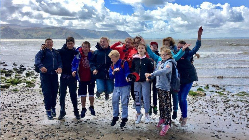 Children from Belarus playing on UK beach