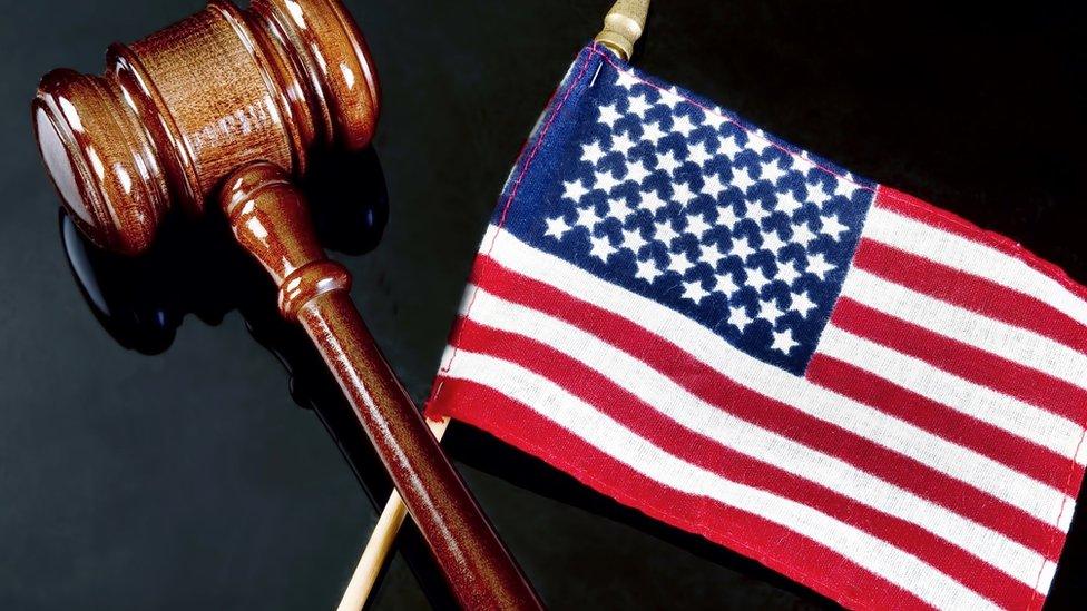 A gavel and US flag