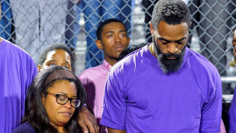 Tyson Gay at a candlelight vigil at Lafayette High School for their daughter Trinity Gay