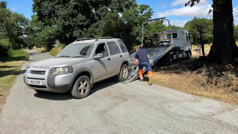 Land Rover Freelander being loaded on to recovery truck