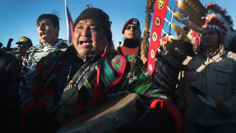 Native American activists celebrate after learning an easement had been denied for the Dakota Access Pipeline at Oceti Sakowin Camp on the edge of the Standing Rock Sioux Reservation