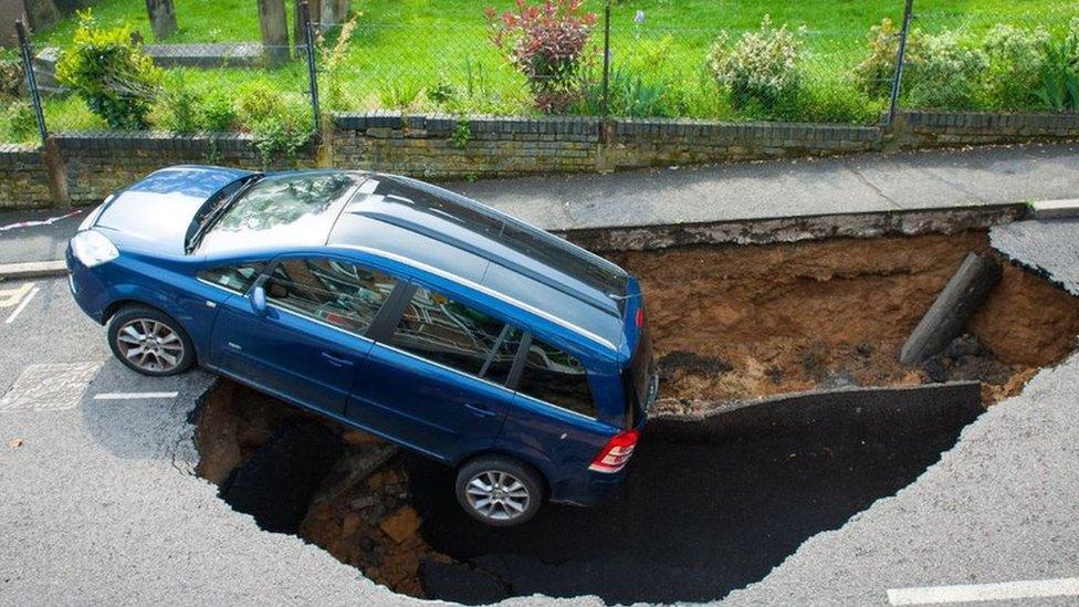 Car in hole