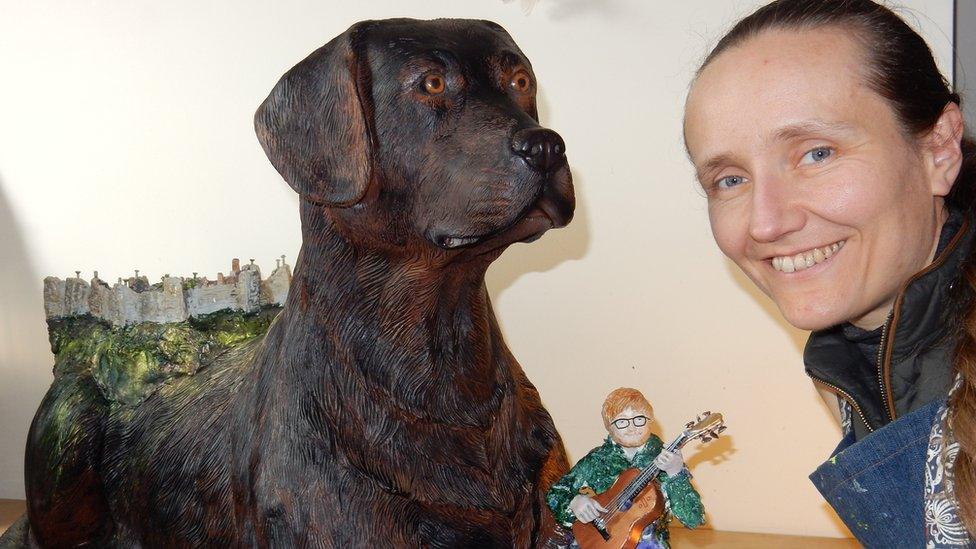 Artist Lois Cordelia with her sculpture Castle on the Dog