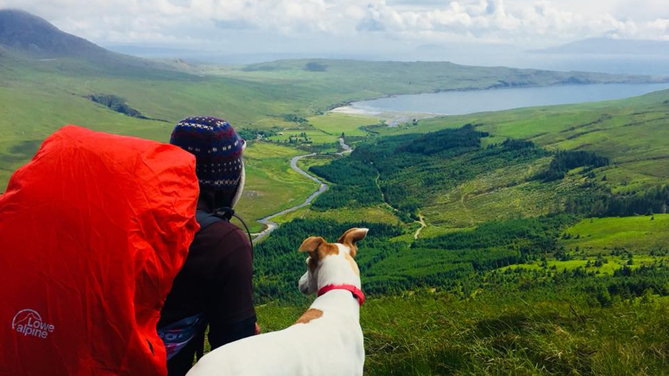 Chris Lewis and Jet overlooking the scenery in Scotland