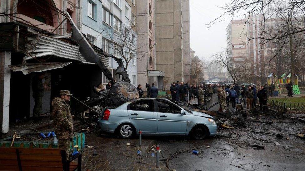 A view shows the site where a helicopter falls on civil infrastructure buildings, amid Russia's attack on Ukraine, in the town of Brovary, outside Kyiv, Ukraine, January 18, 2023