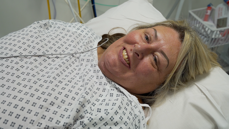 Deborah Horsley in a hospital gown before her surgery