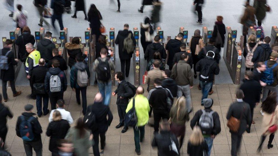 Generic photo of passengers at a train station