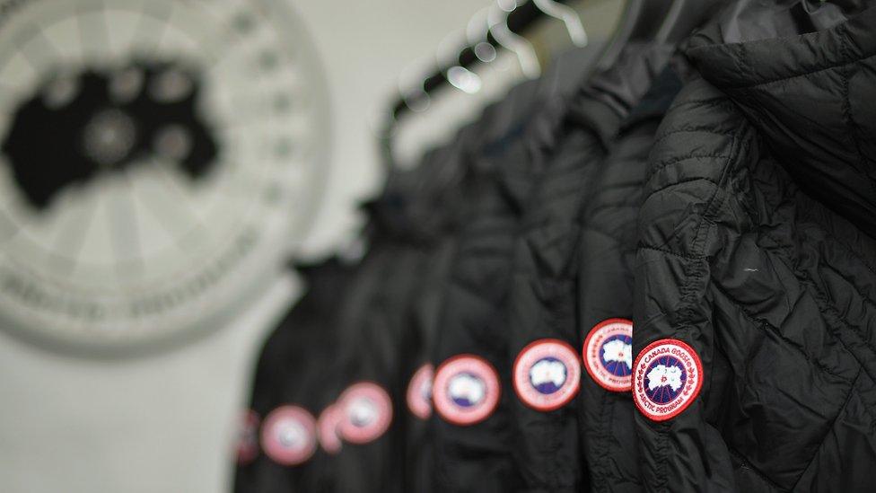 a rack of Canada goose coats