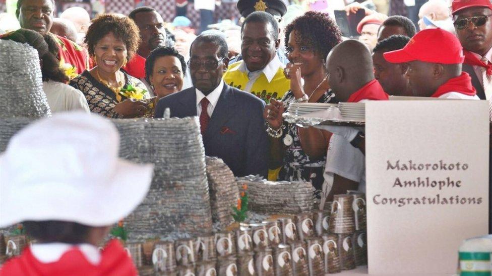 Zimbabwean President Robert Mugabe(C) and his wife Grace (5-R) as they take part in the party for Robert Mugabe's 92nd birthday held in Masvingo, Zimbabwe, 27 February 2016