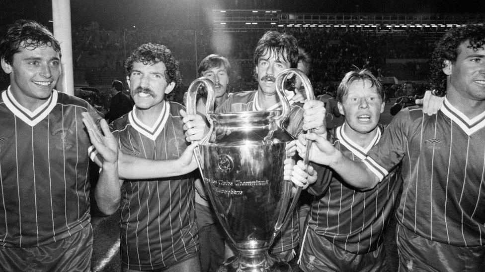 1984 European Cup Final at Stadio Olimpico, Rome. Liverpool 1-1 As Roma. Liverpool won 4-2 on penalties. Liverpool players left to right: Michael Robinson, Graeme Souness, Mark Lawrenson, Sammy Lee and Craig Johnston celebrate with the trophy on a lap of honour after the match, 30th May 1984.